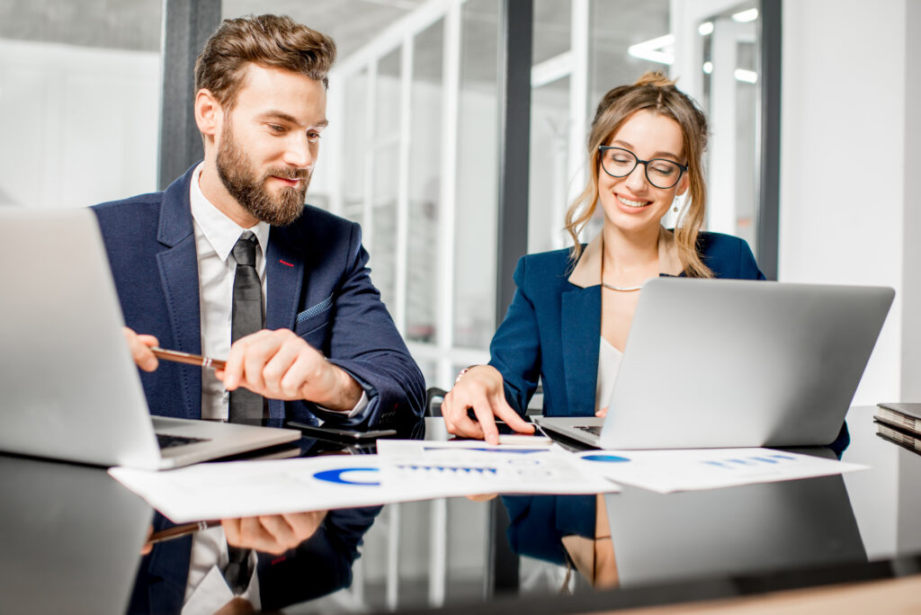 Business accounting professionals reviewing financial charts